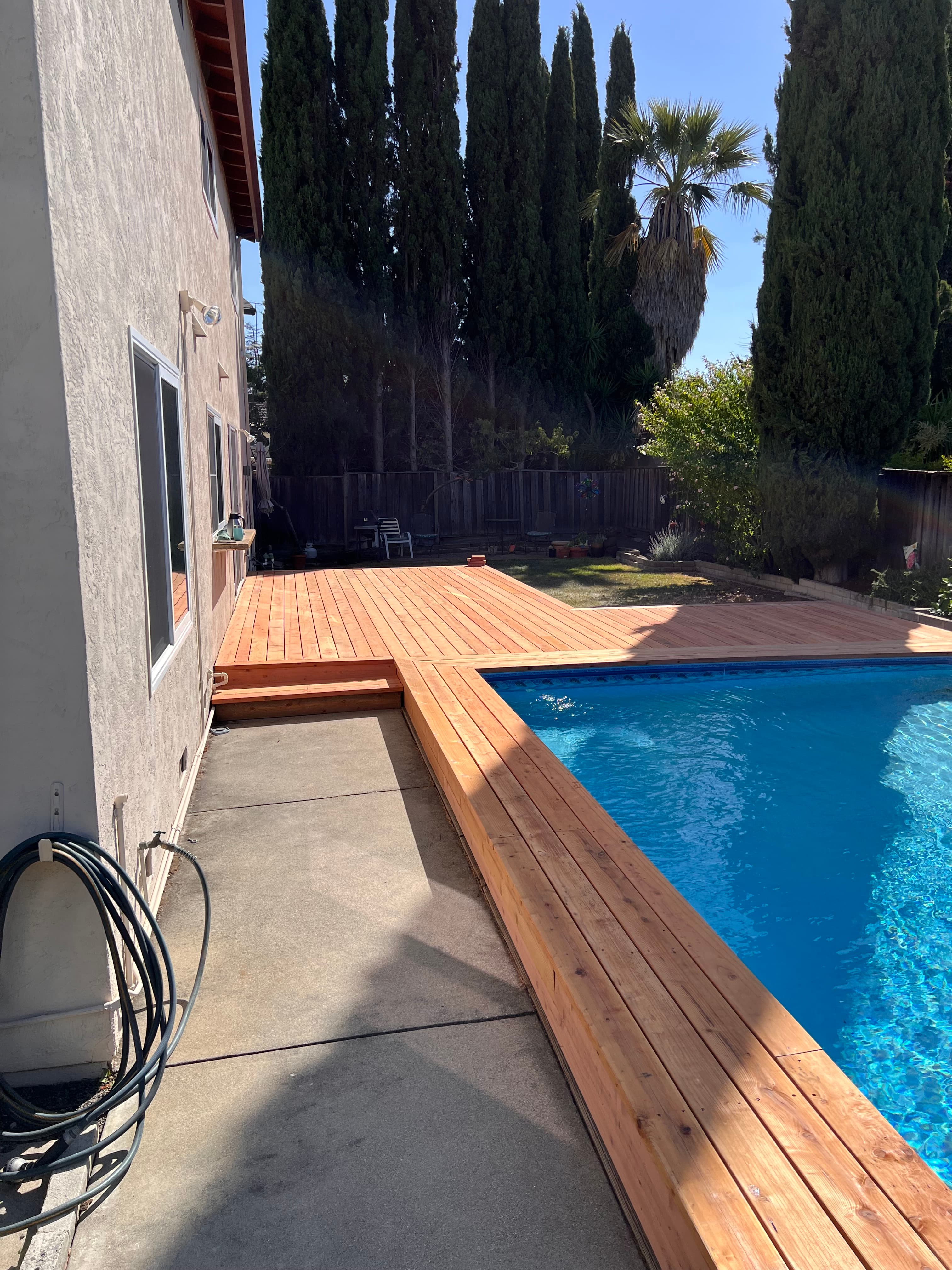 Cedar wood pool deck installation by Far West Builders SF Bay Area general contractor